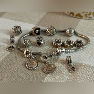 Pandora sterling silver bracelet and 12 charms
